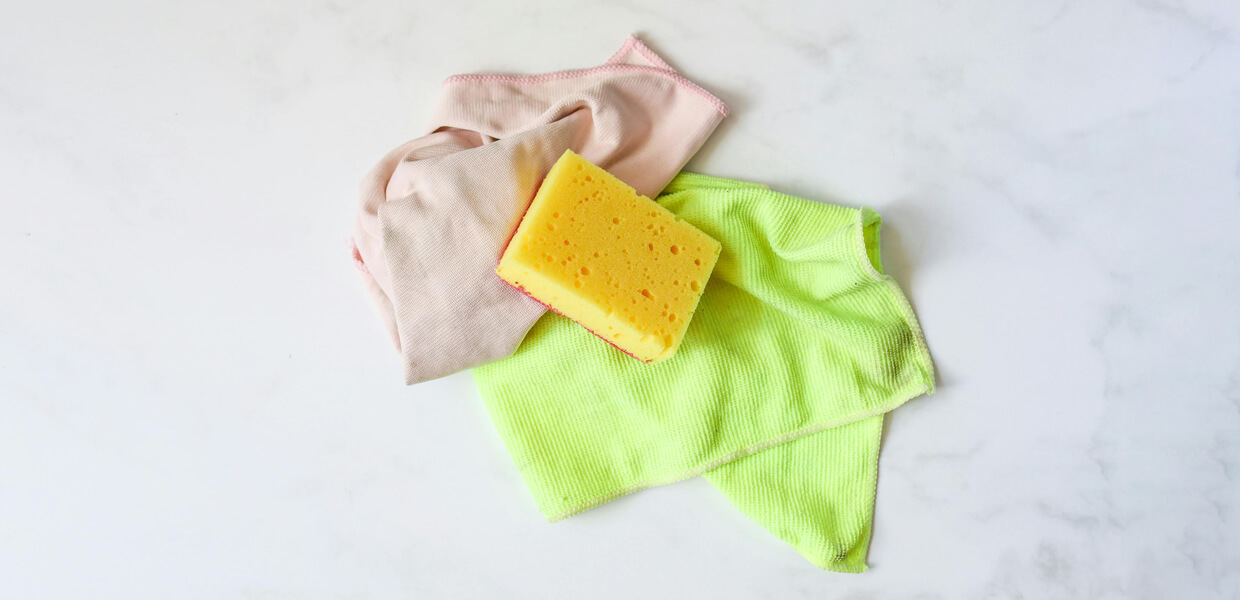 a collection of microfibre cloths displayed on a white marble worktop